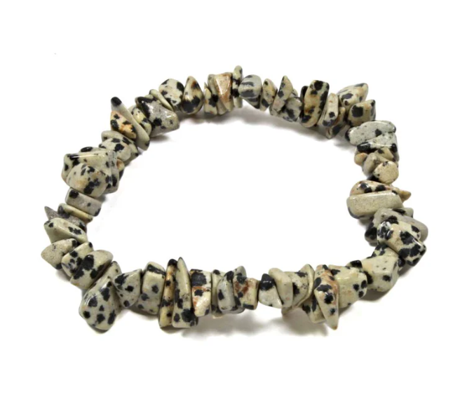 Bracelet made of natural stone beads on a white background