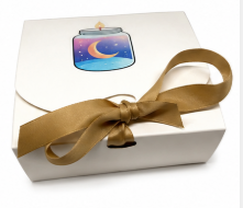 Gift box with a gold bow and a colorful label on a white background