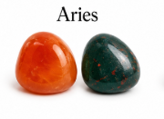 Two stones, one red and one green, labeled 'Aries' on a white background.