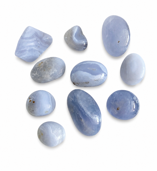 Collection of blue stones on a white background