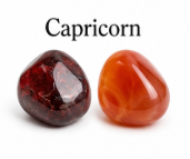 Two gemstones, one red and one orange, with 'Capricorn' text above them.