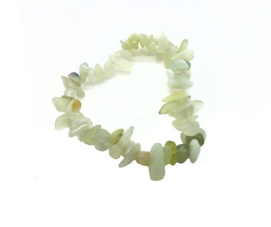 Neon green bracelet with chip stones on a white background