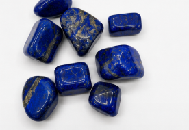 Blue stones with gold inclusions on a white background