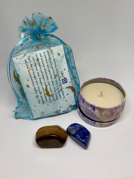 Decorative bag with text, a candle, and two stones on a white background
