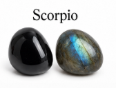 Two stones, one black and one with a multicolored pattern, labeled 'Scorpio'.